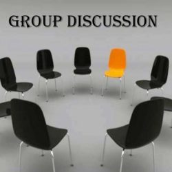 A group of chairs in a circle – one orange and others black, denoting an outstanding individual within a group.