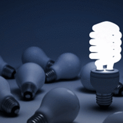A group of light bulbs, with only one shining brightly, leading the question – “what makes you different?” from the perspective of an MBA interview panel.